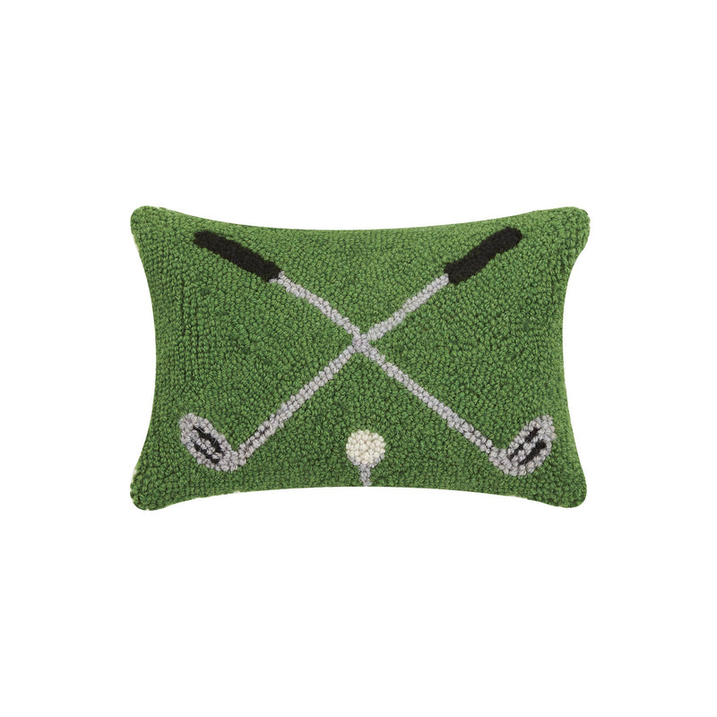 Decorative pillow with golf club and ball design on a green background