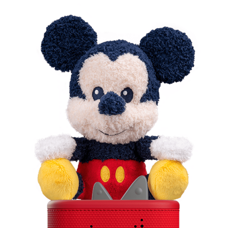Plush toy resembling a well-known character with navy blue ears and red outfit on a white background