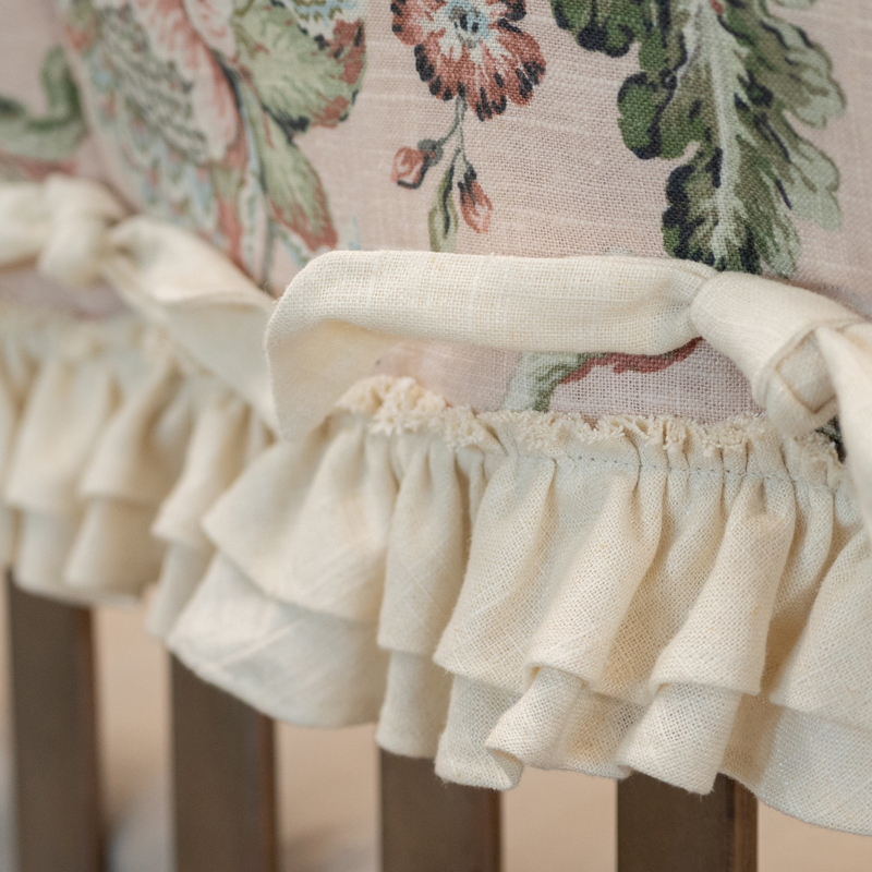 Close-up of a floral chair with ruffled fabric