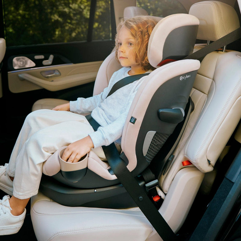Child riding in the Cybex Callisto G 360 in belt-positioning booster mode
