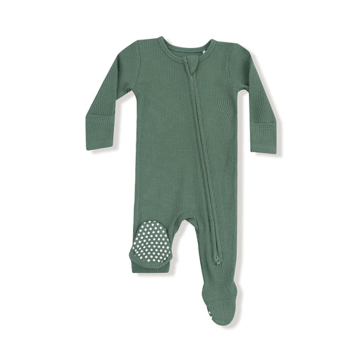 Flat lay of a dark green waffle footie with a diagonal zipper.
