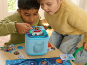 Kids playing Disney Quiz Kingdom on a Toniebox 2 with Tonieplay controller and game pieces