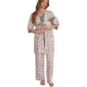 Woman wearing a floral robe and pajama set holding a baby on a white background