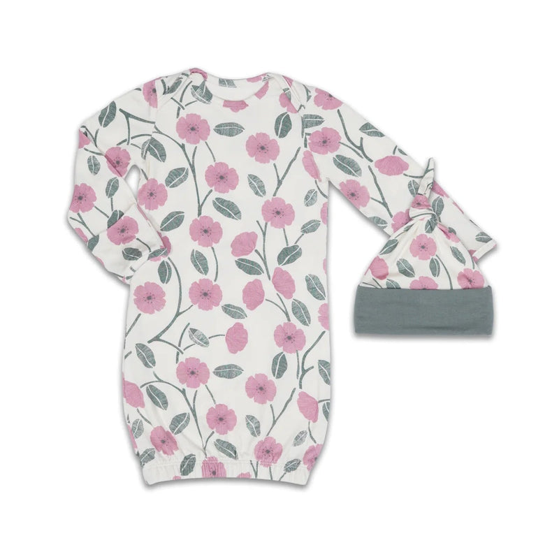 Floral-patterned baby gown and hat set on a white background