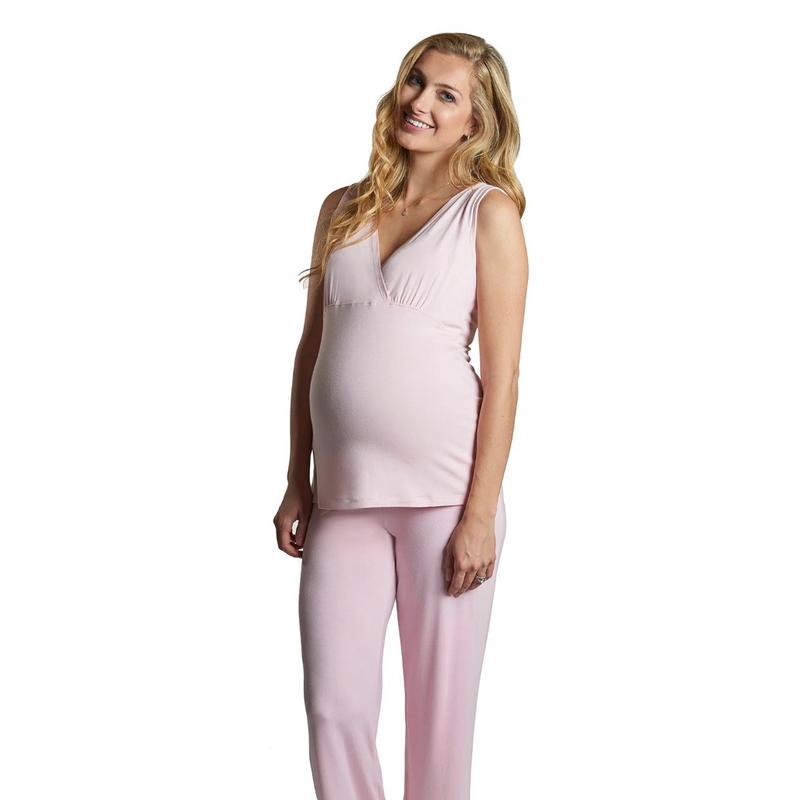 Woman wearing a pink pajama set on a white background