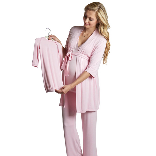 Woman wearing a pink robe holding a matching robe on a hanger against a white background