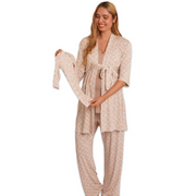 Woman wearing a beige patterned robe and pants on a white background