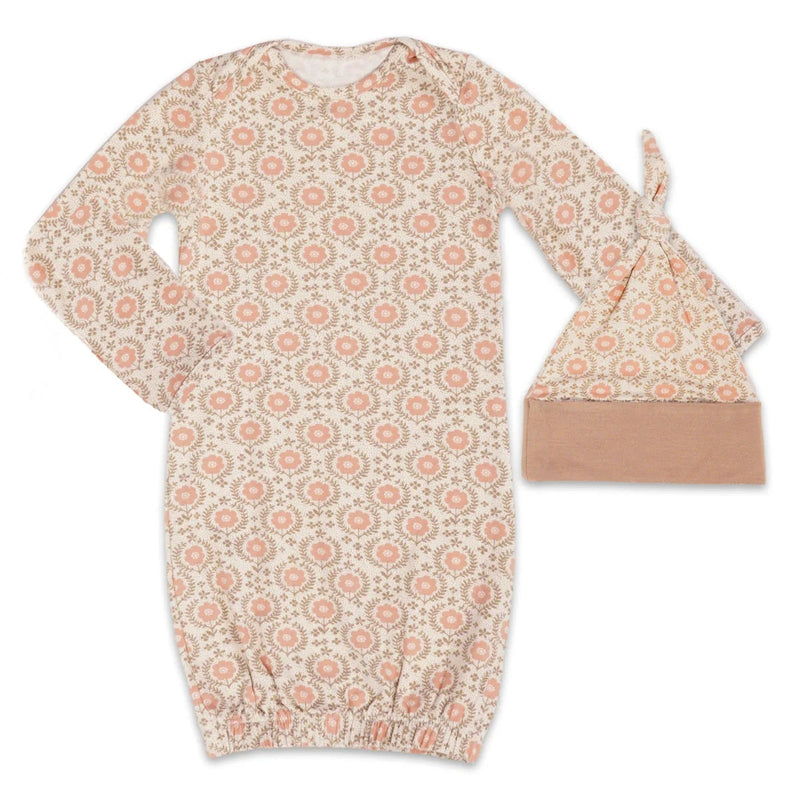 Floral patterned baby gown and hat set on a white background