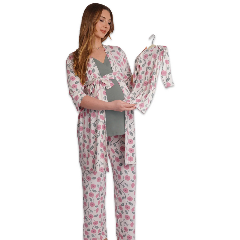 Woman wearing a floral robe and pants with a matching outfit on a white background