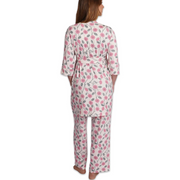 Woman wearing a floral pajama set on a white background