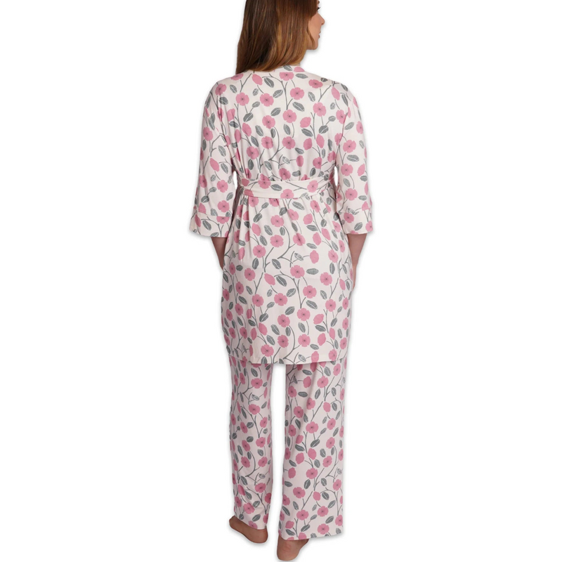 Woman wearing a floral pajama set on a white background