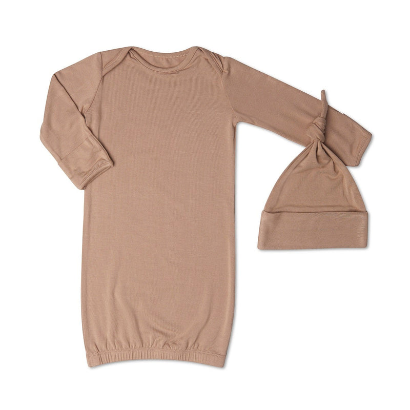 Brown baby gown and hat set on a white background