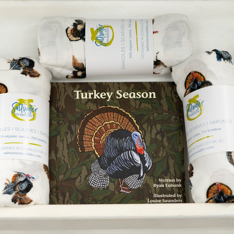 Turkey Season Mossy Oak Edition board book displayed with turkey print swaddle blankets