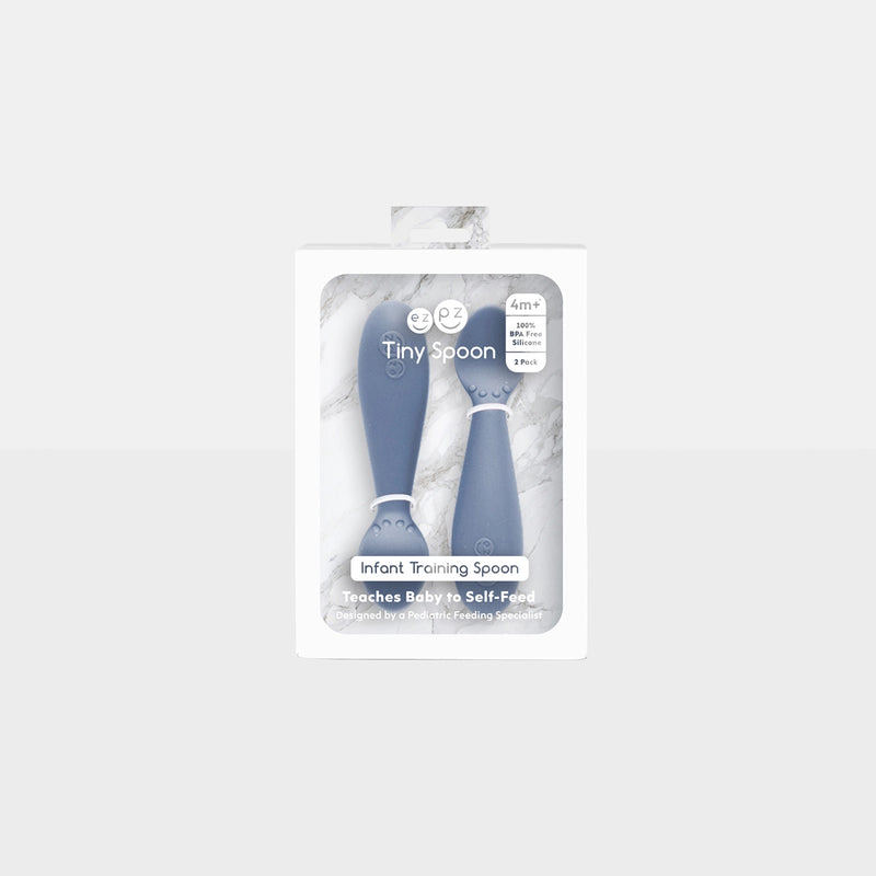 ezpz Tiny Spoon 2-pack silicone infant training spoons in Indigo, in package