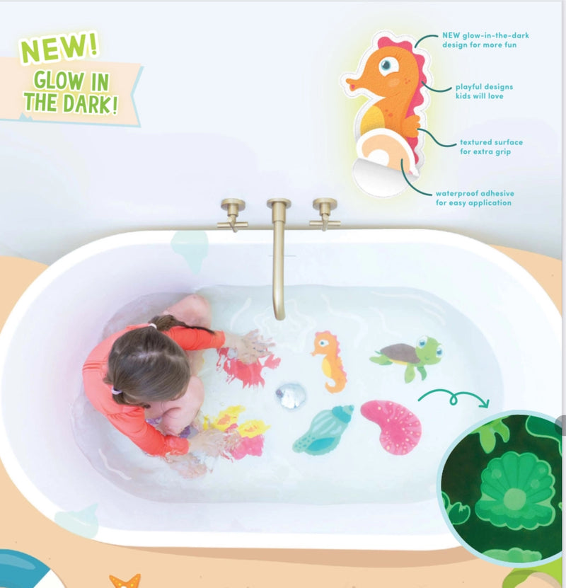Child in a bathtub with Guppy Grips stickies, showing glow-in-the-dark, textured grip and waterproof adhesive features
