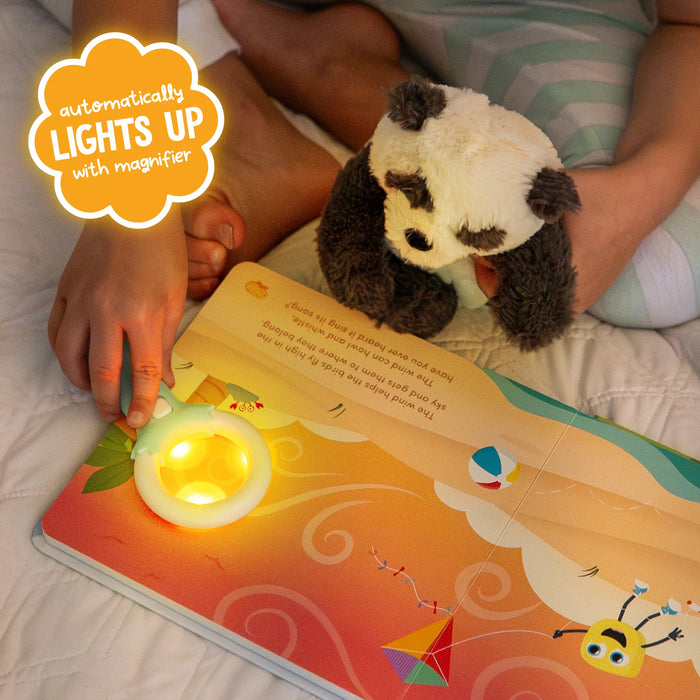 adult helping child reveal glowing details on a page with magic magnifier