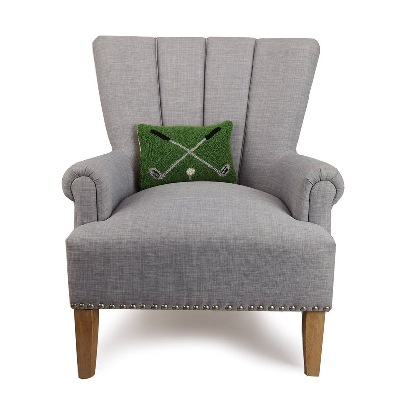 Gray armchair with a green cushion featuring a pattern on a white background