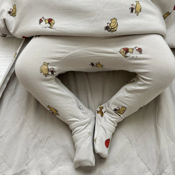 closeup of baby legs inside gunamuna pooh sleep bag showing cozy fit