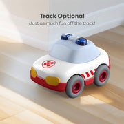 Toy car with blue light on a wooden floor, text 'Track Optional. Just as much fun off the track!' above.