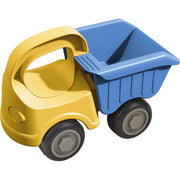 Toy dump truck with yellow body and blue bed on a white background
