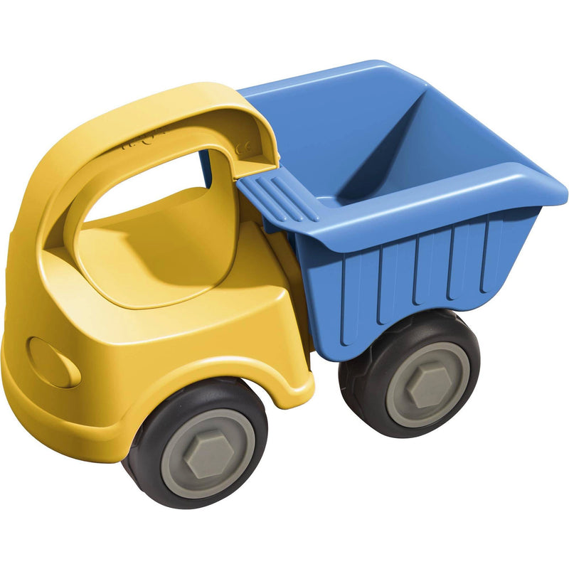 Toy dump truck with yellow body and blue bed on a white background