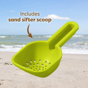 Green sand sifter scoop on a beach with text indicating its inclusion.