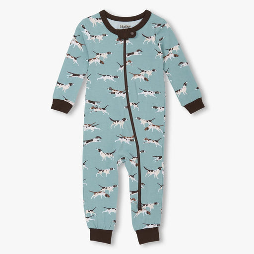 Blue-green bamboo coverall with hunting dog print, asymmetrical zipper, and brown trim and cuffs