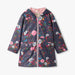Hatley Peplum Rain Jacket in fall floral print front view with peplum hem and hood