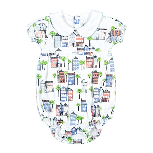 Baby romper with colorful house and palm tree pattern on a white background