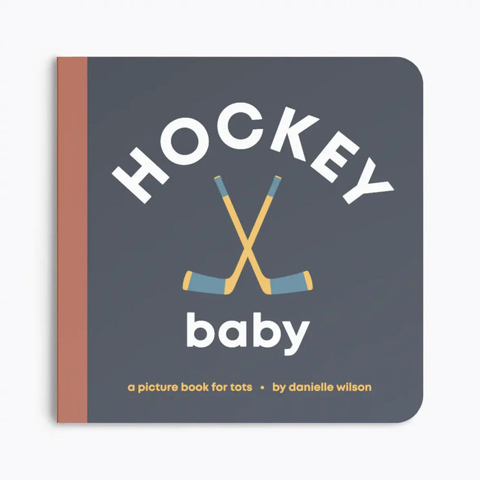 Book titled 'Hockey Baby' with hockey sticks on a gray background