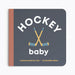 Book titled 'Hockey Baby' with hockey sticks on a gray background