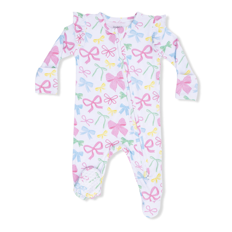 Baby onesie with colorful bow pattern on a white background
