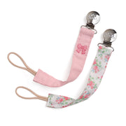 Pink and floral pacifier clip on a white background