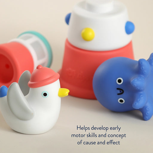 Colorful rubber bath toys on a light background with text about developmental benefits.