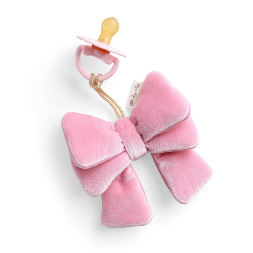Pink bow-shaped teether with a pacifier on a white background