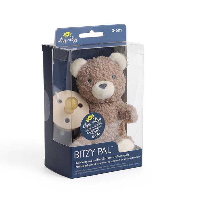 Plush toy bear in packaging with 'Itty Bitty' branding on a white background