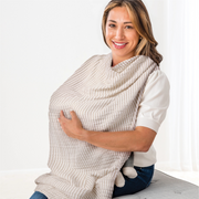 Woman using a baby wrap carrier on a white background