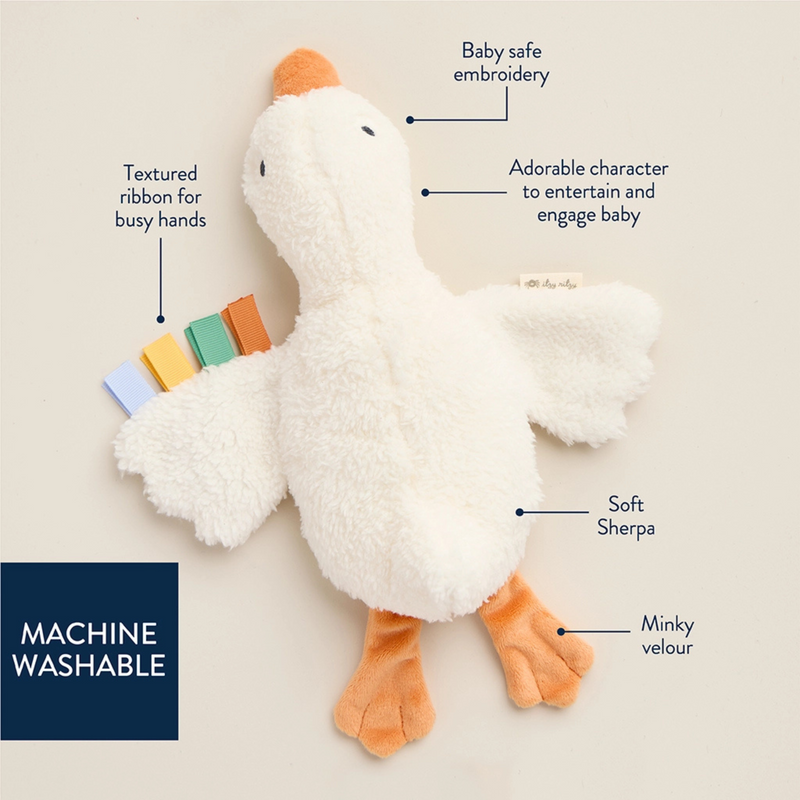 White plush toy with colorful accents on a beige background, featuring text labels about its features.