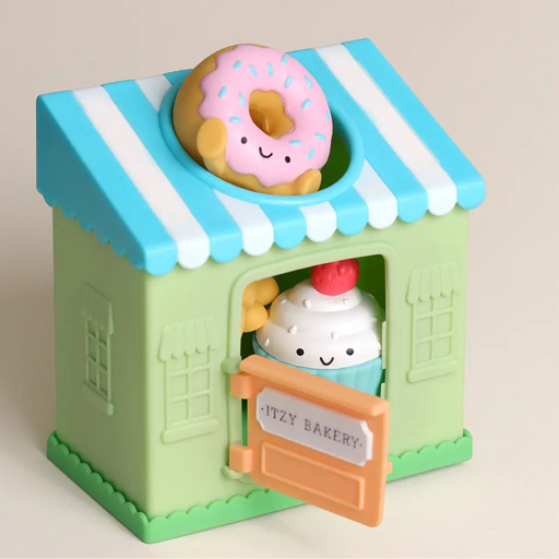 Itzy Play Bakery put and take activity toy shaped like a bakery with striped roof and hinged door