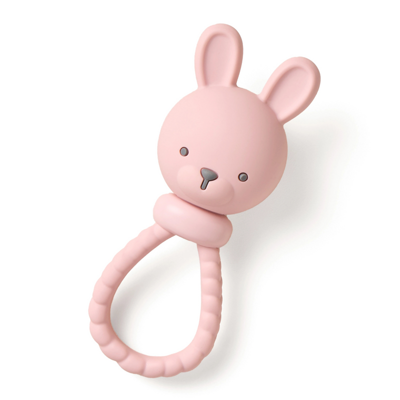 Pink bunny-shaped teething ring on a white background