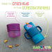 Kiddy Trek 4-in-1 Sip & Snack Set with purple container and blue cup on a concrete surface.