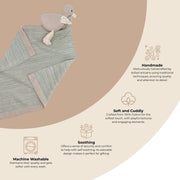 Baby blanket with plush toy on a beige background, featuring text about product features.