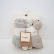 Baby blanket with toy on a hanger against a white background, featuring a 'Crane' brand tag.