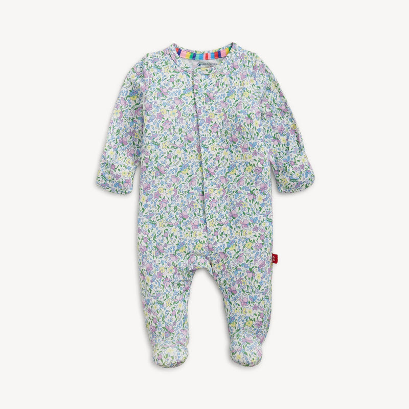 Baby magnetic footie sleeper with lavender floral print laid flat