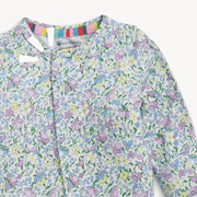 Close-up of lavender floral magnetic footie front neckline and pattern