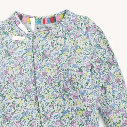 Close-up of lavender floral magnetic footie front neckline and pattern