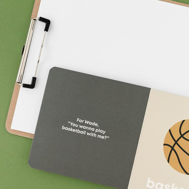 Basketball Baby board book open to the first page with a clipboard