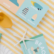 Beach Baby board book pages with a sand shovel, starfish and sunglasses