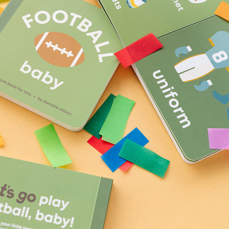 Football Baby board book open to the uniform page with confetti
