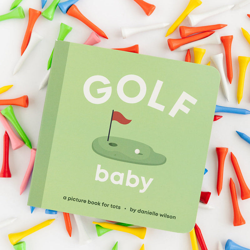 Golf Baby board book surrounded by colorful golf tees